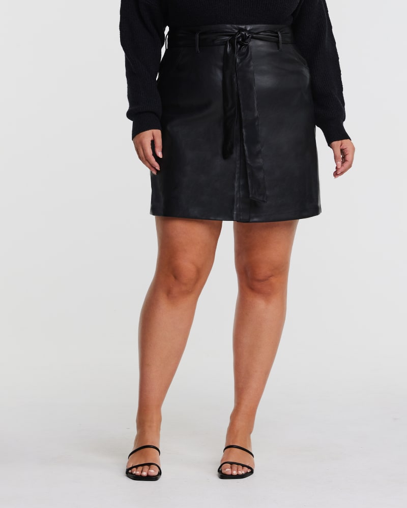 Front of a model wearing a size 22W Pu Belted Skirt in BLACK by Estelle. | dia_product_style_image_id:315693